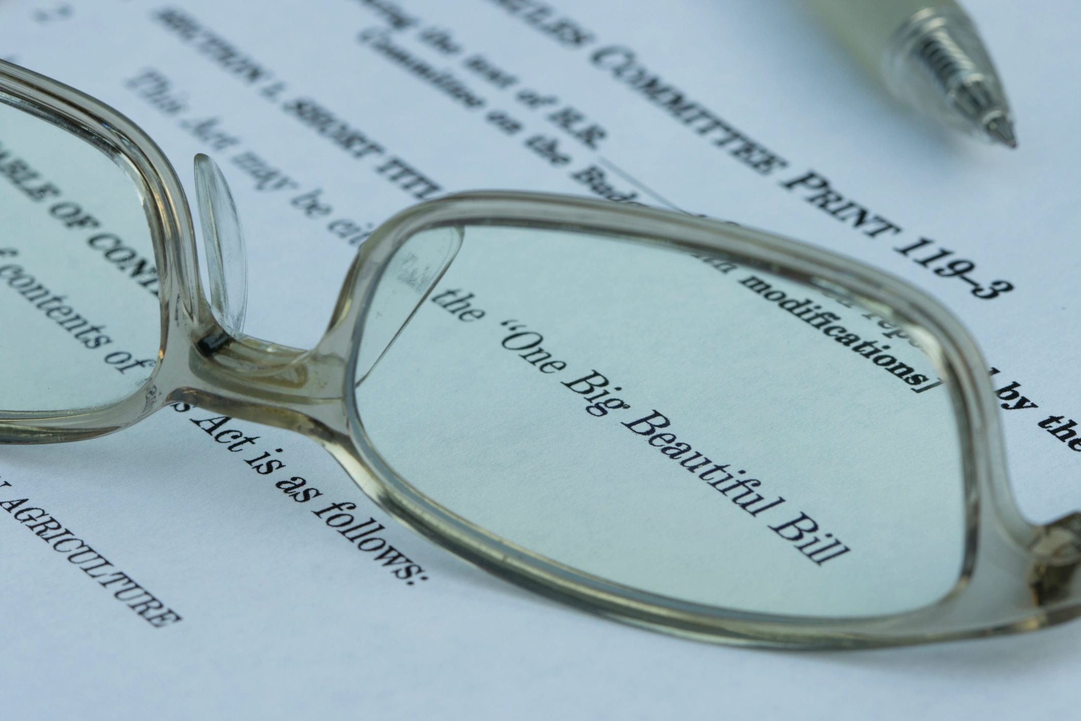 Legislative document with reading glasses